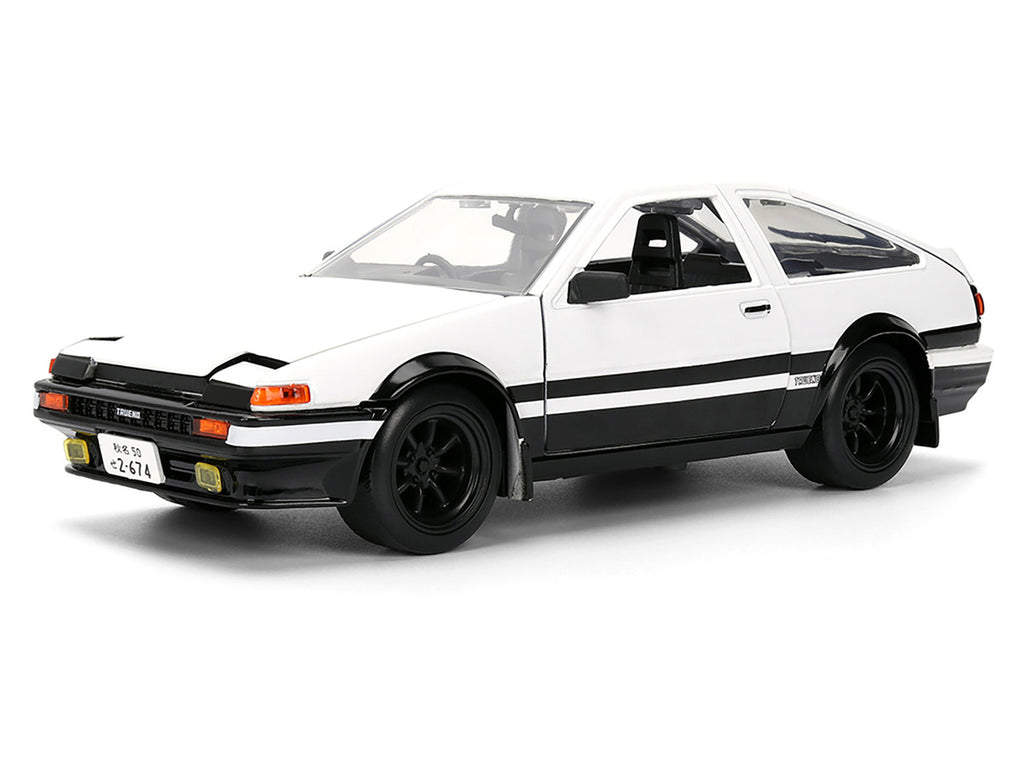 Toyota Trueno (AE86) RHD (Right Hand Drive) White and Black with Graphics and Takumi Diecast Figure "Initial D" (1998-2021) TV Series "Anime Hollywood Rides" Series 1/24 Diecast Model by Jada