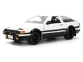Toyota Trueno (AE86) RHD (Right Hand Drive) White and Black with Graphics and Takumi Diecast Figure "Initial D" (1998-2021) TV Series "Anime Hollywood Rides" Series 1/24 Diecast Model by Jada